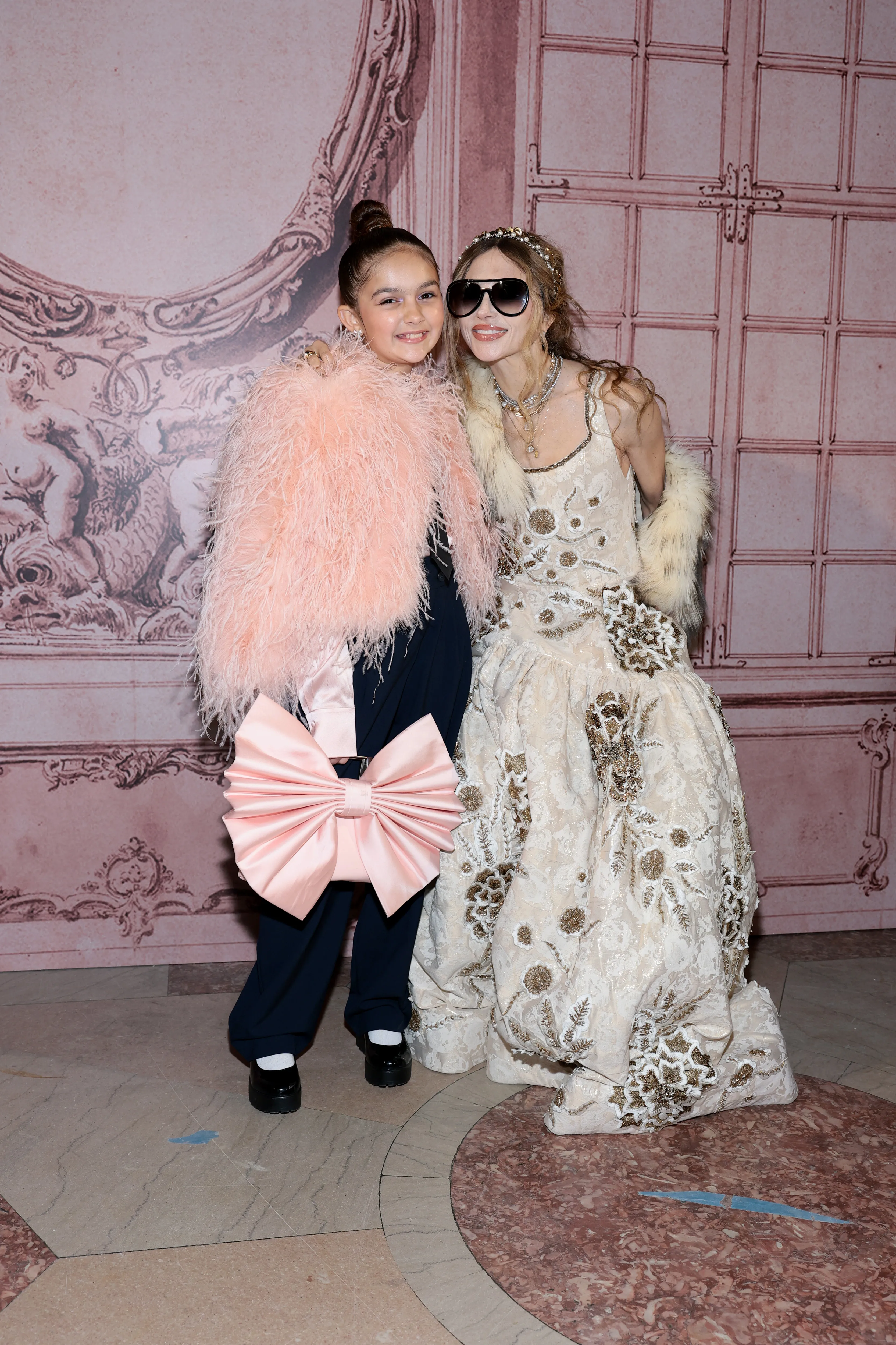 Taylen Biggs wearing the ALICE + OLIVIA Brady Silk Blouse and Kidman Feathered Jacket at New York Fashion Week